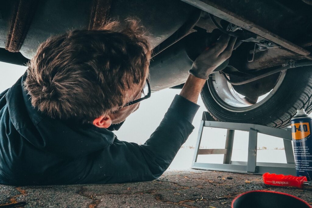 mechanic under a car