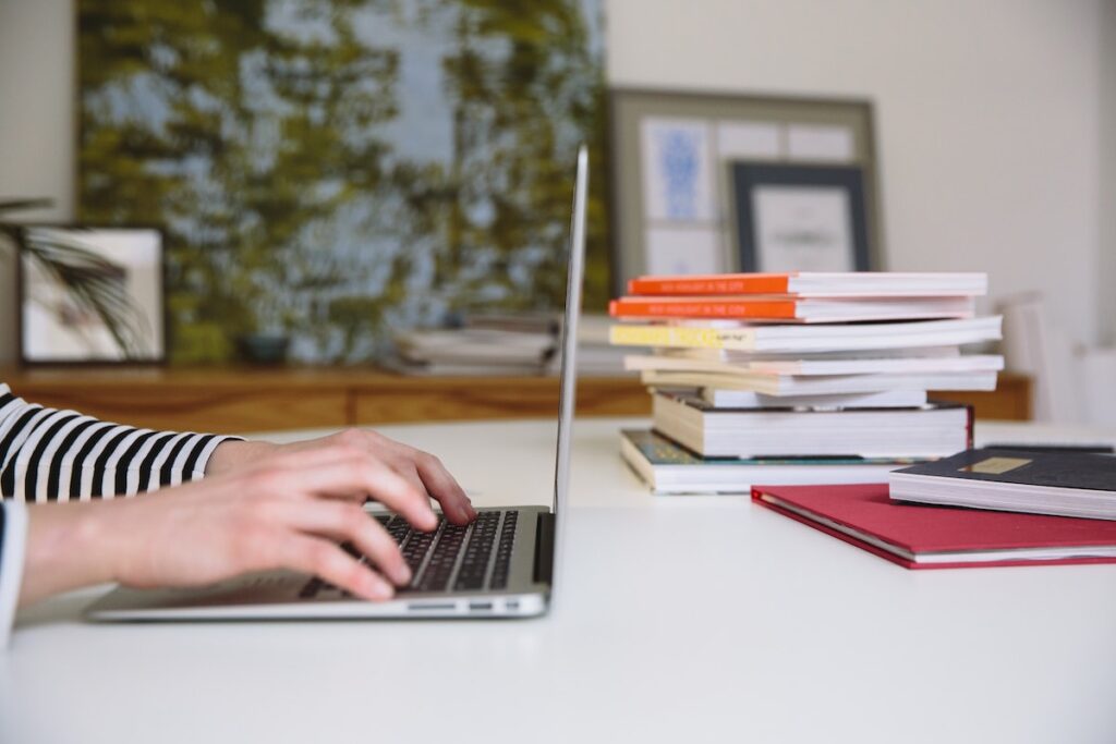 female hands on laptop