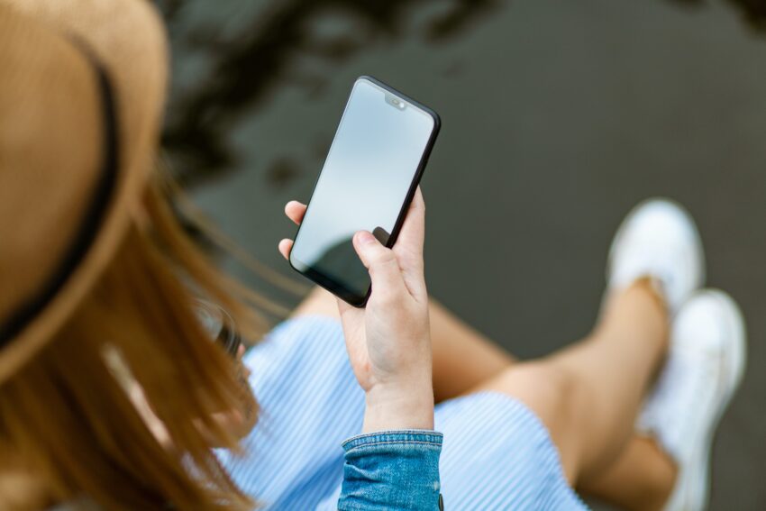 woman holding phone